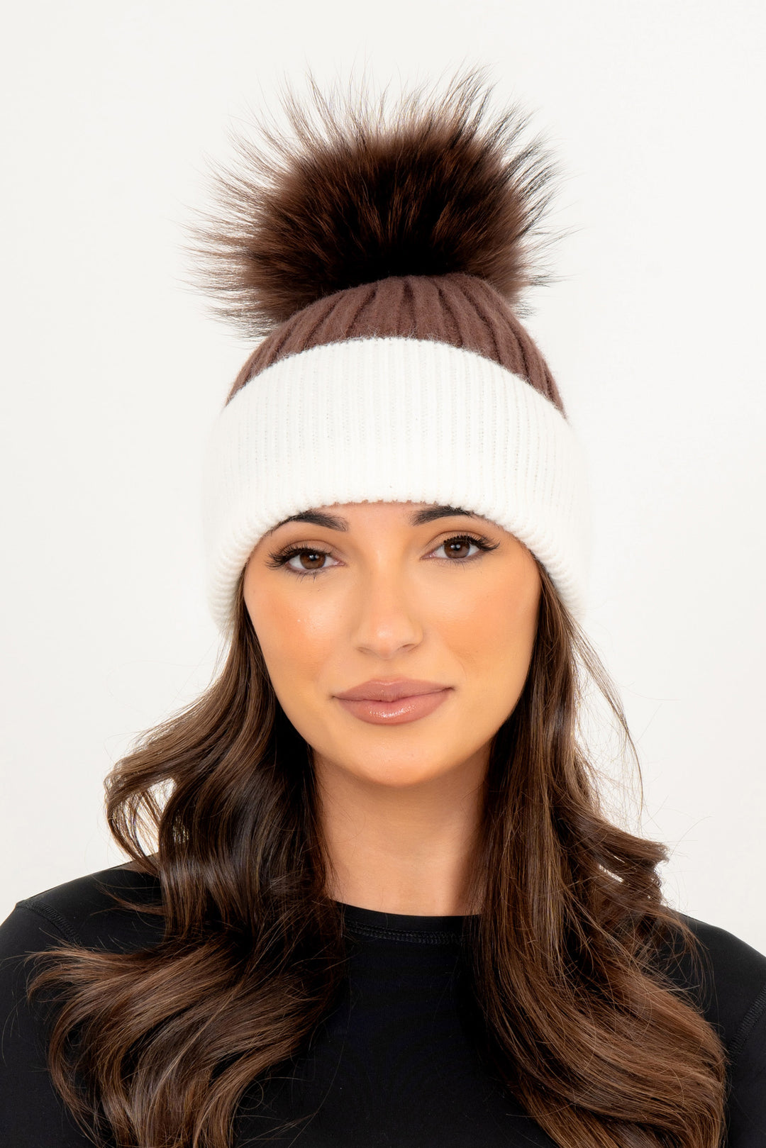 Black hat with brown bobble deals